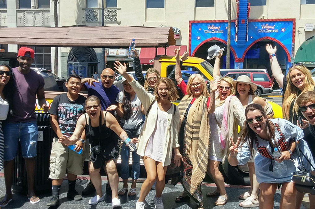 Group of smiling tour guests enjoying their Hollywood City Tour